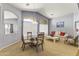 Bright dining area adjacent to living room with vaulted ceilings at 29875 N Sedona Pl, San Tan Valley, AZ 85143