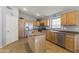 Spacious kitchen with oak cabinets, island, and stainless steel appliances at 29875 N Sedona Pl, San Tan Valley, AZ 85143