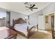 Bright main bedroom with wood furniture and ensuite bathroom at 29875 N Sedona Pl, San Tan Valley, AZ 85143