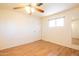 Spacious bedroom featuring a ceiling fan and wood floors at 345 S 58Th St # 27, Mesa, AZ 85206