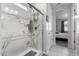 Elegant bathroom with marble shower and glass enclosure at 35170 W La Paz St, Maricopa, AZ 85138