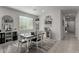 Charming dining room features a farmhouse table and stylish decor at 35170 W La Paz St, Maricopa, AZ 85138