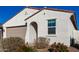 Single story home with tan garage door and desert landscaping at 35170 W La Paz St, Maricopa, AZ 85138