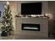 Modern electric fireplace with white mantel and holiday decor at 35170 W La Paz St, Maricopa, AZ 85138