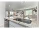 Kitchen island with granite countertop and stainless steel sink at 35170 W La Paz St, Maricopa, AZ 85138