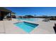 Community pool and spa with plenty of lounge chairs at 35170 W La Paz St, Maricopa, AZ 85138