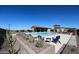 Community pool with lounge chairs and a shaded pergola at 35170 W La Paz St, Maricopa, AZ 85138