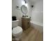 Cozy bathroom featuring a stylish vanity with wood cabinet and modern fixtures at 4032 N 11Th Ave, Phoenix, AZ 85013