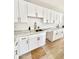 White shaker cabinets, marble countertops, and stylish hardware at 4032 N 11Th Ave, Phoenix, AZ 85013