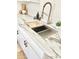 Modern kitchen sink with marble countertop and wood cutting board at 4032 N 11Th Ave, Phoenix, AZ 85013