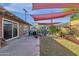 Large backyard with patio, shade sails, and raised garden beds at 4048 W Sierra Vista Dr, Phoenix, AZ 85019