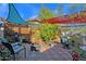 Outdoor patio with seating, fire pit, shade sails, and potted plants at 4048 W Sierra Vista Dr, Phoenix, AZ 85019