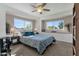 Spacious bedroom with a ceiling fan, large windows, and ample natural light at 4048 W Sierra Vista Dr, Phoenix, AZ 85019