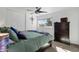 Comfortable bedroom with a dresser and green bedding at 4048 W Sierra Vista Dr, Phoenix, AZ 85019