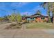 Cute brick home with teal accents and a grassy yard at 4048 W Sierra Vista Dr, Phoenix, AZ 85019