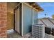 Exterior view of the home with an AC unit and storage area at 4048 W Sierra Vista Dr, Phoenix, AZ 85019