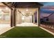 Large covered back porch with a ceiling fan and a view of the yard at 42085 W Morning Glory Way, Maricopa, AZ 85138
