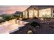 Beautiful desert landscaped backyard with a cozy pergola area and tiled patio at 42085 W Morning Glory Way, Maricopa, AZ 85138