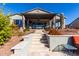 Steps leading up to a covered patio with seating area and a view of the house at 42085 W Morning Glory Way, Maricopa, AZ 85138