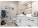 Clean bathroom with white cabinets and gray floor tiles at 42085 W Morning Glory Way, Maricopa, AZ 85138