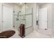 Modern bathroom featuring a large walk-in shower and contemporary tile at 42085 W Morning Glory Way, Maricopa, AZ 85138