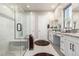 Elegant bathroom with double sinks, a walk-in shower, and modern fixtures at 42085 W Morning Glory Way, Maricopa, AZ 85138