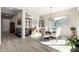 Elegant dining room with wood table and modern lighting at 42085 W Morning Glory Way, Maricopa, AZ 85138