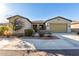 Single-story home with two-car garage and desert landscaping at 42085 W Morning Glory Way, Maricopa, AZ 85138