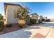 Side view of single-story home with desert landscaping at 42085 W Morning Glory Way, Maricopa, AZ 85138