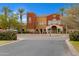 Inviting multi-toned building featuring a grand entrance with a water fountain, enhanced by lush landscaping at 42085 W Morning Glory Way, Maricopa, AZ 85138