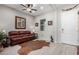 Living room with leather couch, wood floors, and western decor at 42085 W Morning Glory Way, Maricopa, AZ 85138