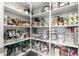 Well-organized pantry with ample shelving for storage at 42085 W Morning Glory Way, Maricopa, AZ 85138