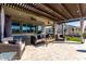 Covered patio with seating area and pergola at 42085 W Morning Glory Way, Maricopa, AZ 85138