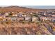 Aerial view of two story house with pool and desert mountain backdrop at 44622 N Sonoran Arroyo Ln, New River, AZ 85087