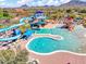 Resort-style community pool with water slides and a play area at 44622 N Sonoran Arroyo Ln, New River, AZ 85087