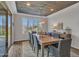 Formal dining room with wood ceiling and large windows at 44622 N Sonoran Arroyo Ln, New River, AZ 85087