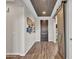 Entryway with barn door and wood-look floors at 44622 N Sonoran Arroyo Ln, New River, AZ 85087