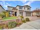 Two-story house with stone accents and a three-car garage at 44622 N Sonoran Arroyo Ln, New River, AZ 85087