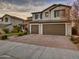 Two-story house with three-car garage and landscaped front yard at 44622 N Sonoran Arroyo Ln, New River, AZ 85087