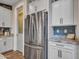 Stainless steel appliances and granite countertops highlight this spacious kitchen at 44622 N Sonoran Arroyo Ln, New River, AZ 85087