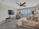 Bright and airy main bedroom with a comfortable sitting area at 44622 N Sonoran Arroyo Ln, New River, AZ 85087