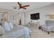 Serene main bedroom with a king-size bed and access to the bathroom at 44622 N Sonoran Arroyo Ln, New River, AZ 85087