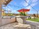 Outdoor kitchen with built-in grill and bar seating at 44622 N Sonoran Arroyo Ln, New River, AZ 85087