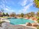 Stunning pool and spa with a waterfall, mountain views, and backyard patio at 44622 N Sonoran Arroyo Ln, New River, AZ 85087