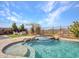 Relaxing backyard oasis with a pool, spa, and patio seating at 44622 N Sonoran Arroyo Ln, New River, AZ 85087