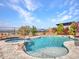 Inviting pool with spa and waterfall feature; expansive mountain views at 44622 N Sonoran Arroyo Ln, New River, AZ 85087