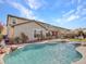 Luxury backyard with a large pool, spa, and outdoor entertaining area at 44622 N Sonoran Arroyo Ln, New River, AZ 85087