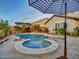 Relax in the inviting pool and spa at 44622 N Sonoran Arroyo Ln, New River, AZ 85087