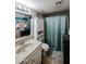 Clean bathroom with a single sink vanity and shower/tub combo at 4539 W Mclellan Rd, Glendale, AZ 85301