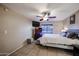 Bright bedroom featuring a ceiling fan and neutral decor at 4539 W Mclellan Rd, Glendale, AZ 85301